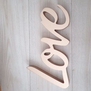 Golden "LOVE" wall decor.